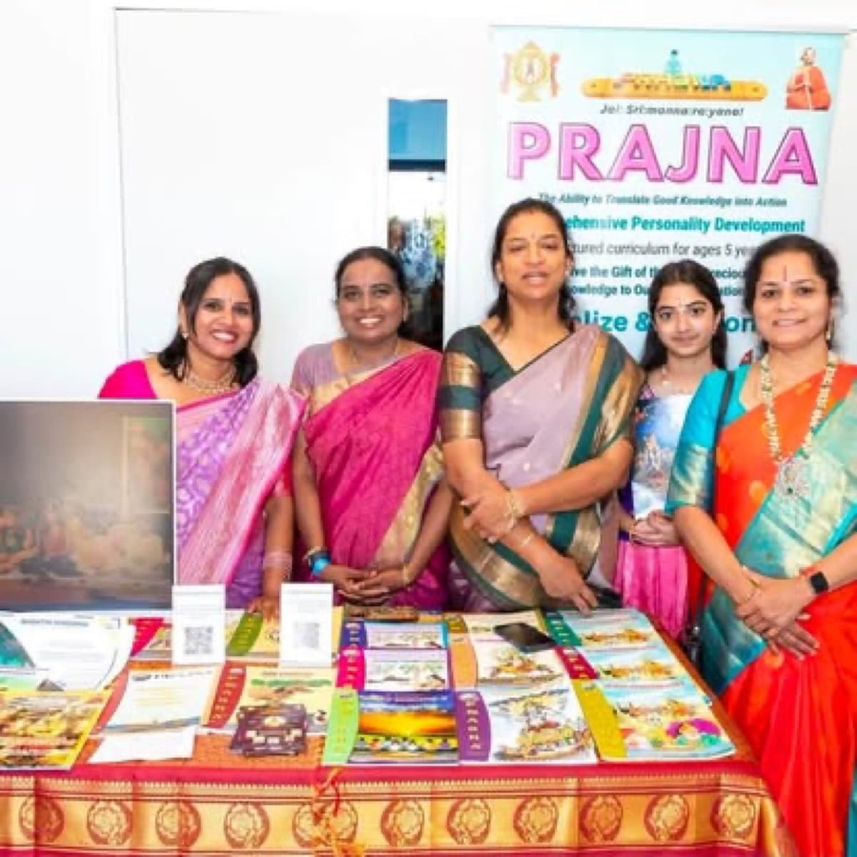Volunteers at the Prajna children's program booth