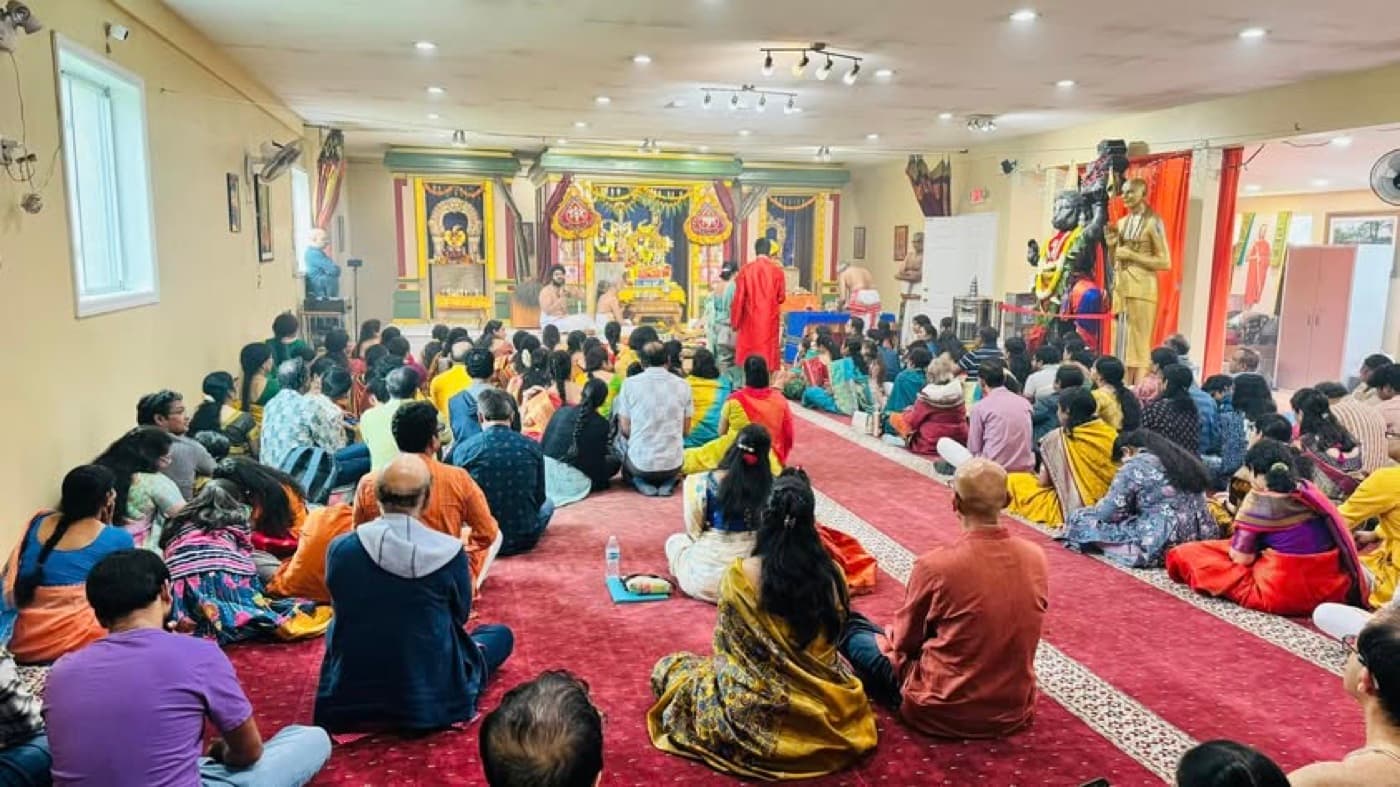 The sabha assembled before the deities